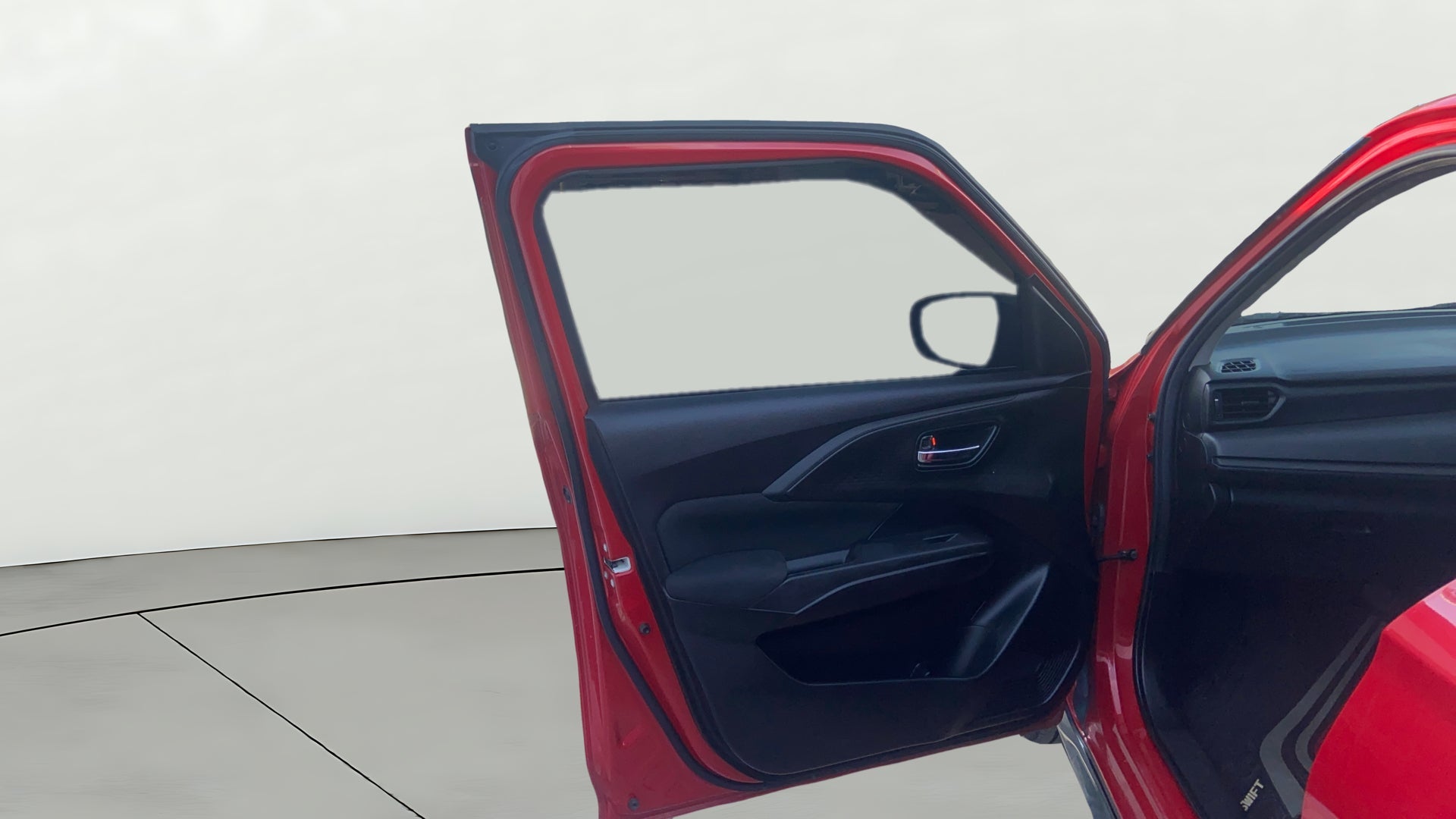 Front passenger door interior of a Maruti Suzuki Swift