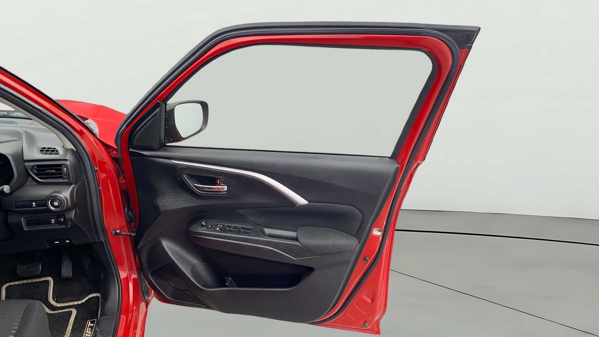 Driver side door panel of a Maruti Suzuki Swift