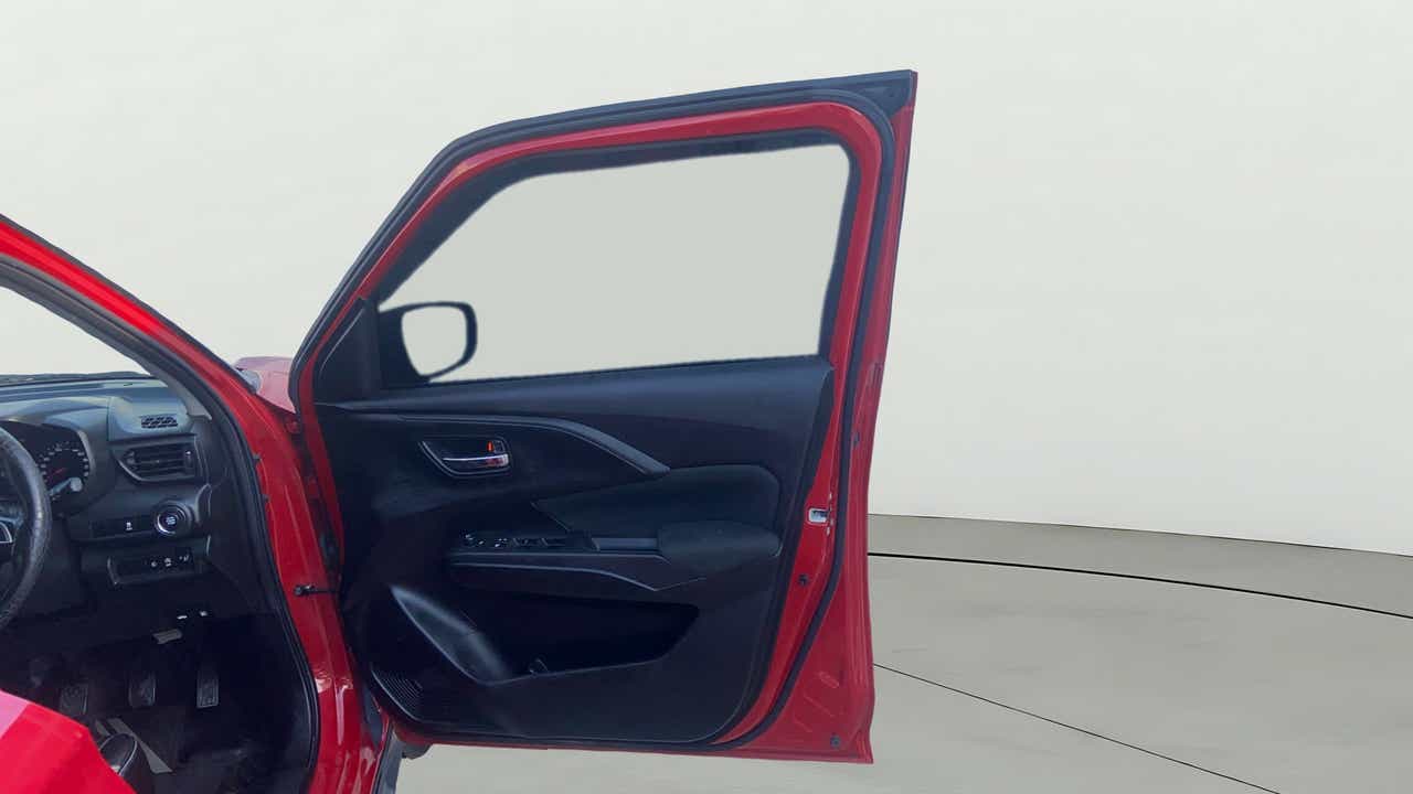 Driver side door interior of a Maruti Suzuki Swift