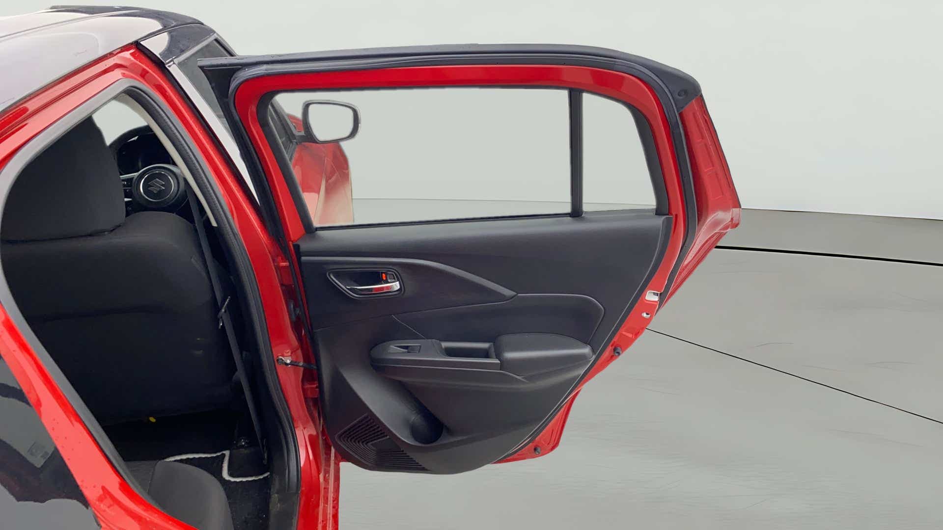 Rear door interior view of a Maruti Suzuki Swift