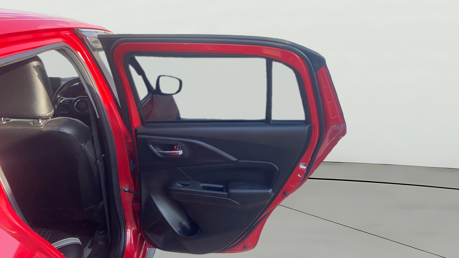 Rear door interior view of a Maruti Suzuki Swift