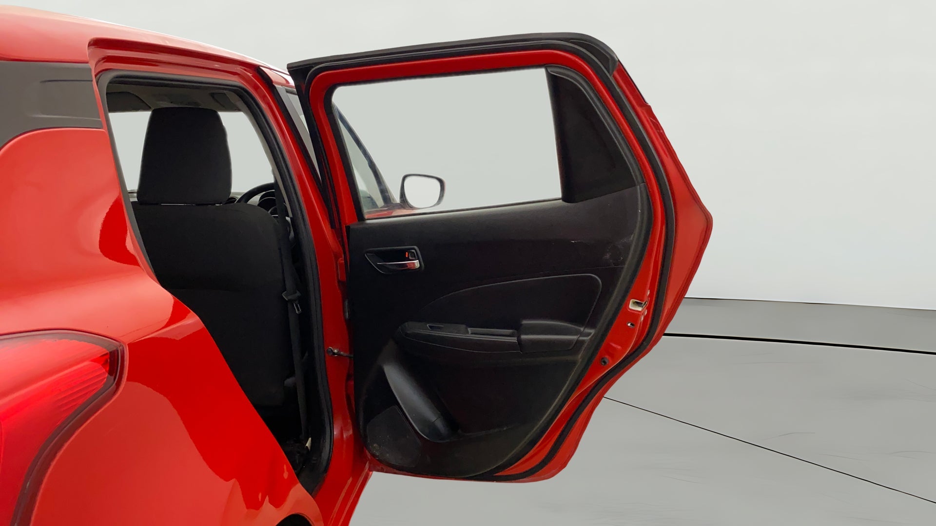 Rear door open view of a Maruti Suzuki Swift 2021 - 2023