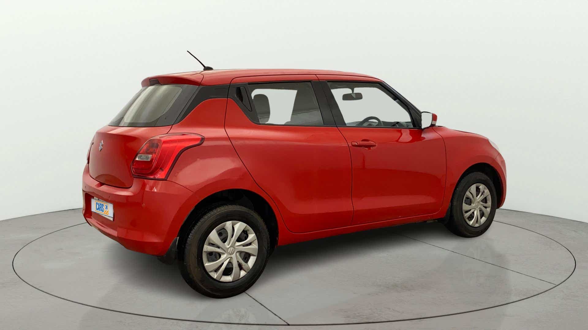 Rear three-quarter view of a maruti suzuki swift 2021 - 2023