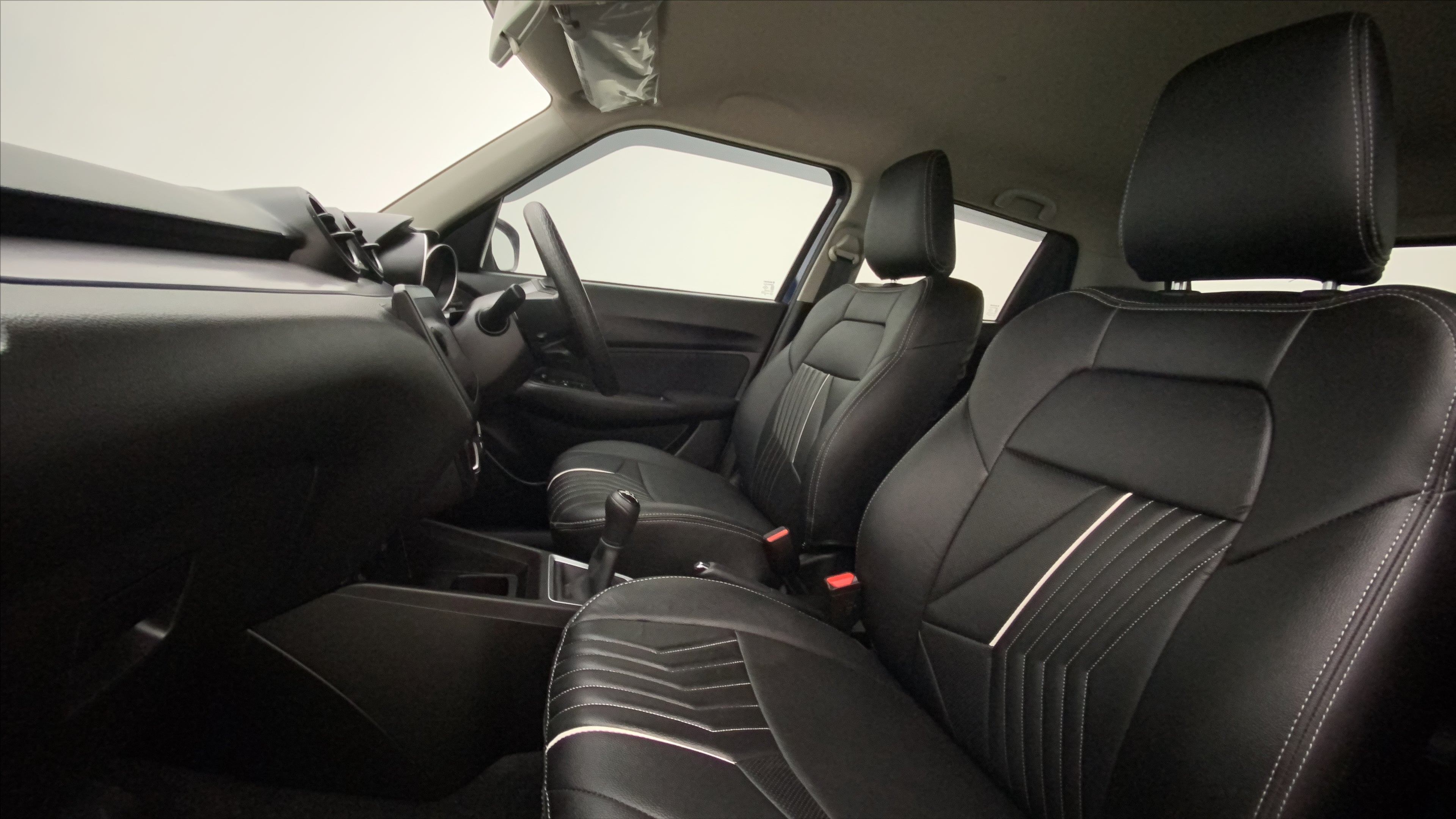 Front seat and dashboard view of a Maruti Suzuki Swift 2021 - 2023
