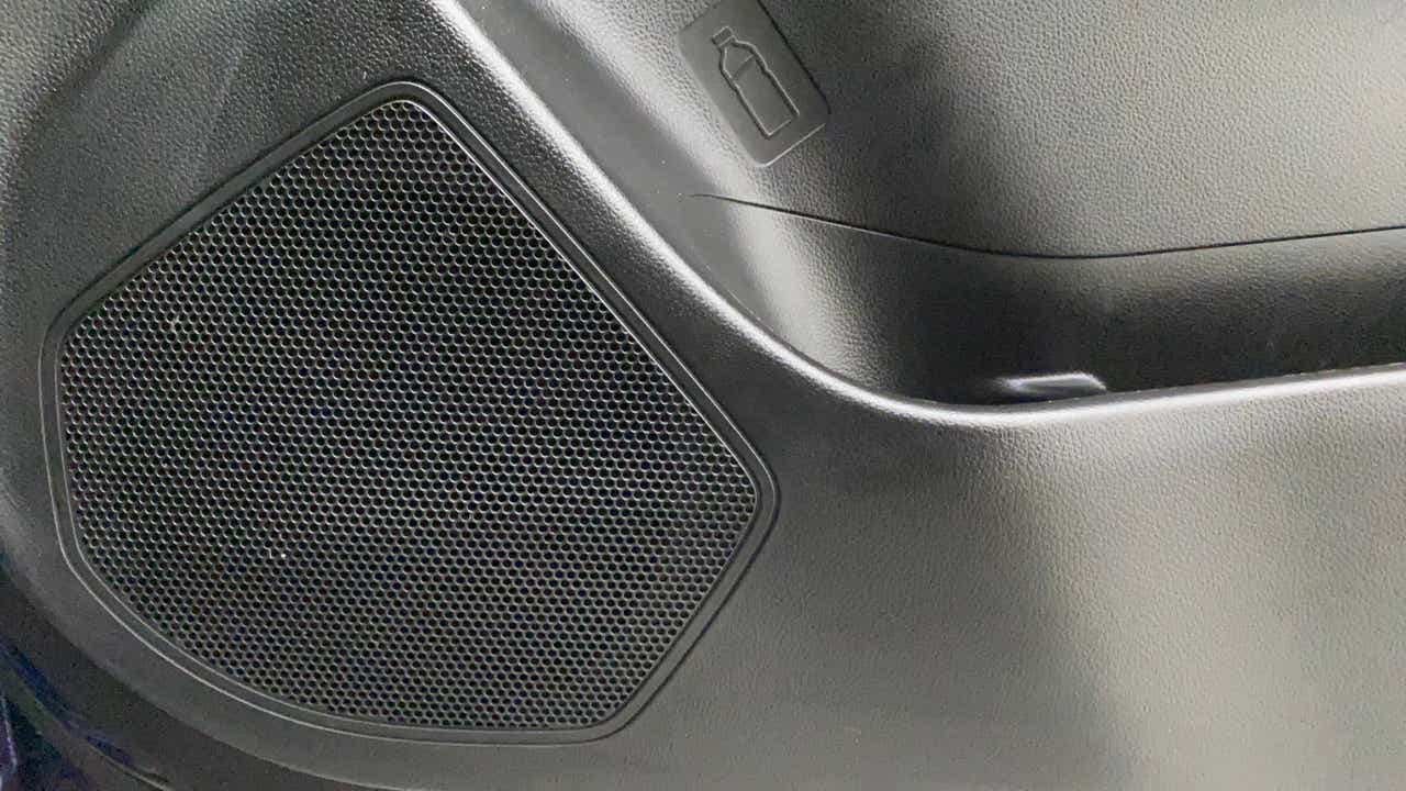 Speaker grille and door trim of a Maruti Suzuki Swift 2021 - 2023