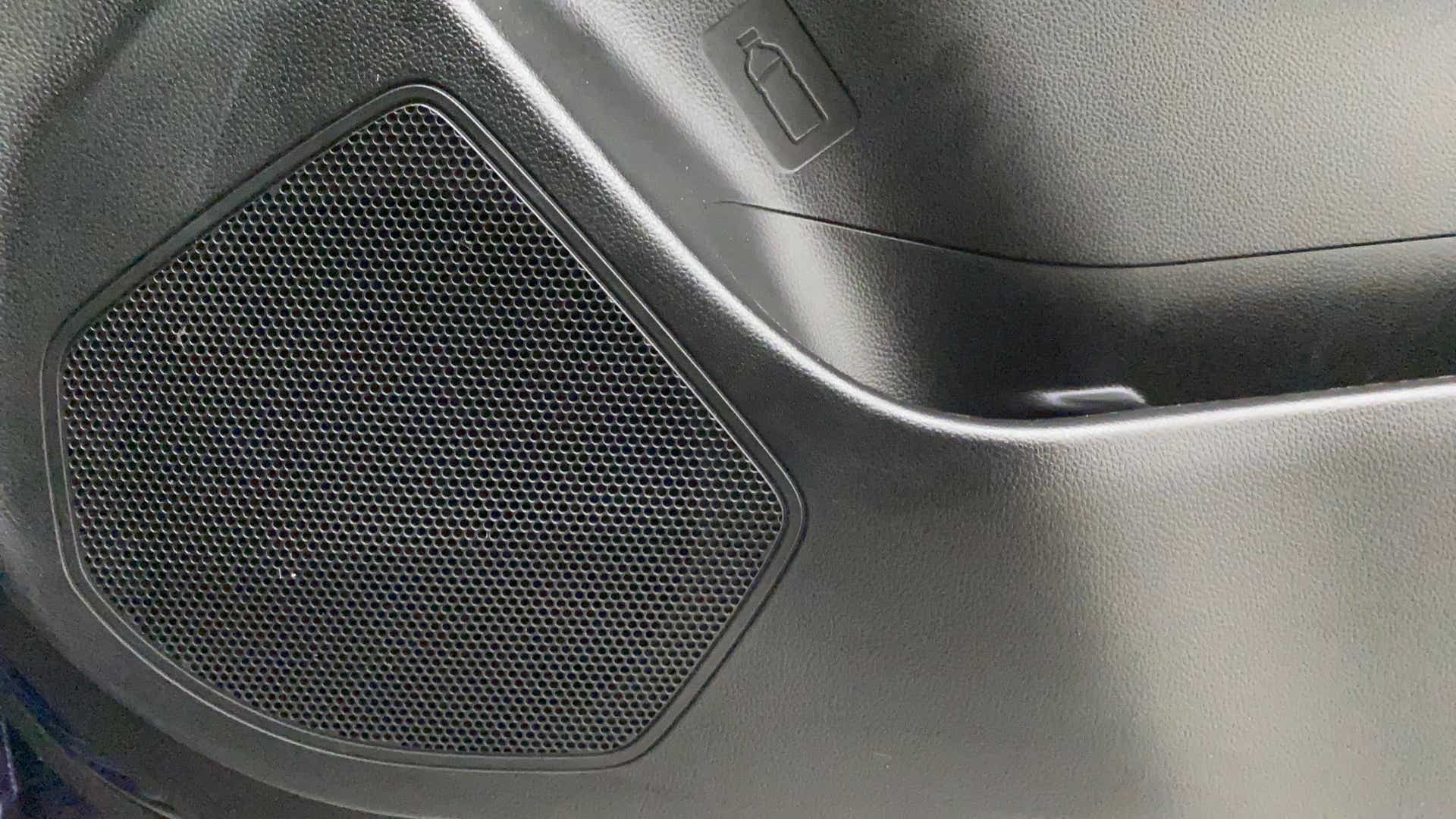 Speaker grille and door trim of a Maruti Suzuki Swift 2021 - 2023