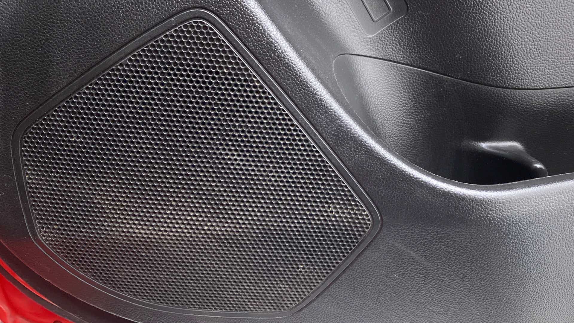 Close-up of the speaker grille on a Maruti Suzuki Swift 2021 - 2023