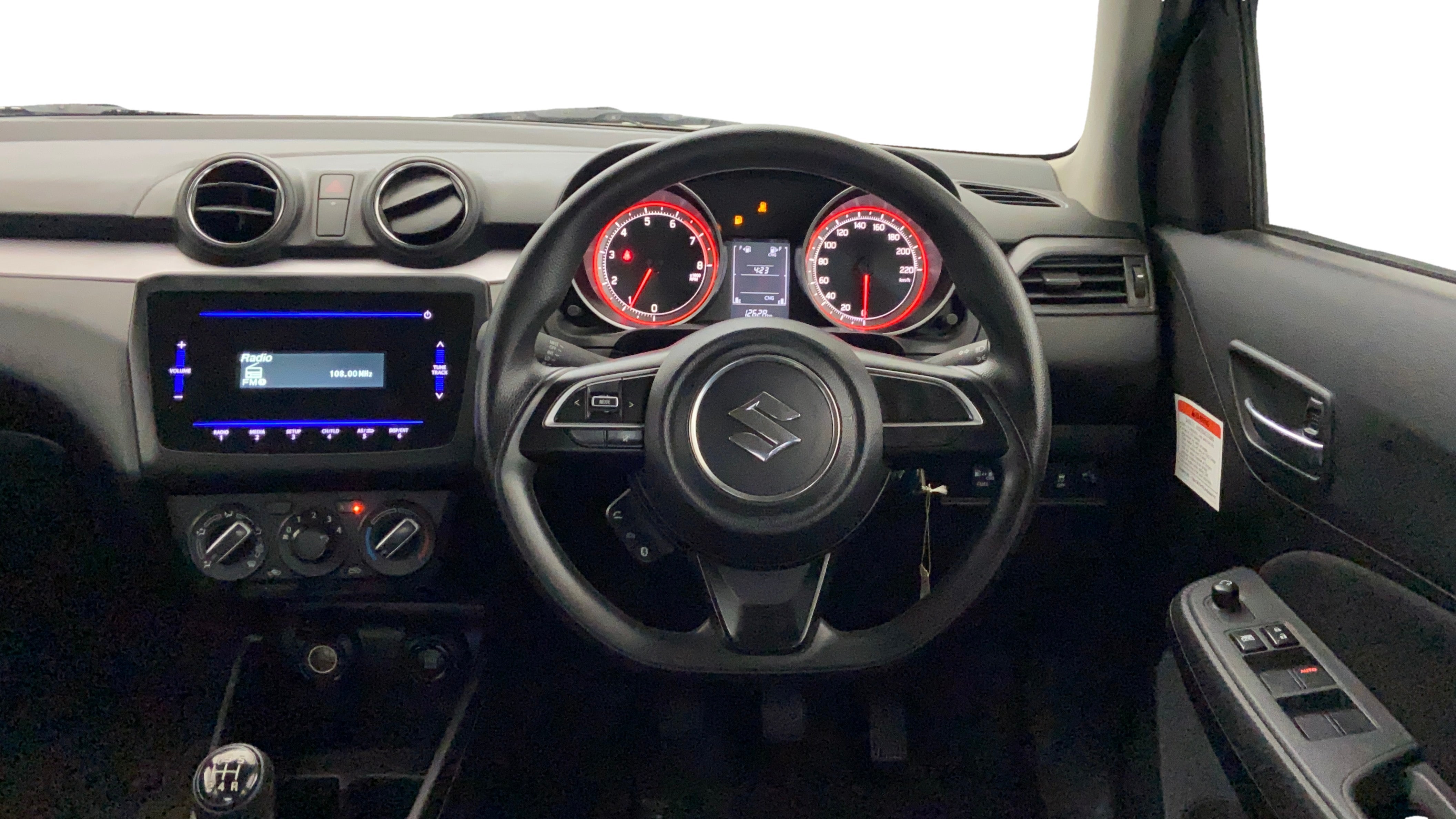 Dashboard and steering wheel view of a Maruti Suzuki Swift