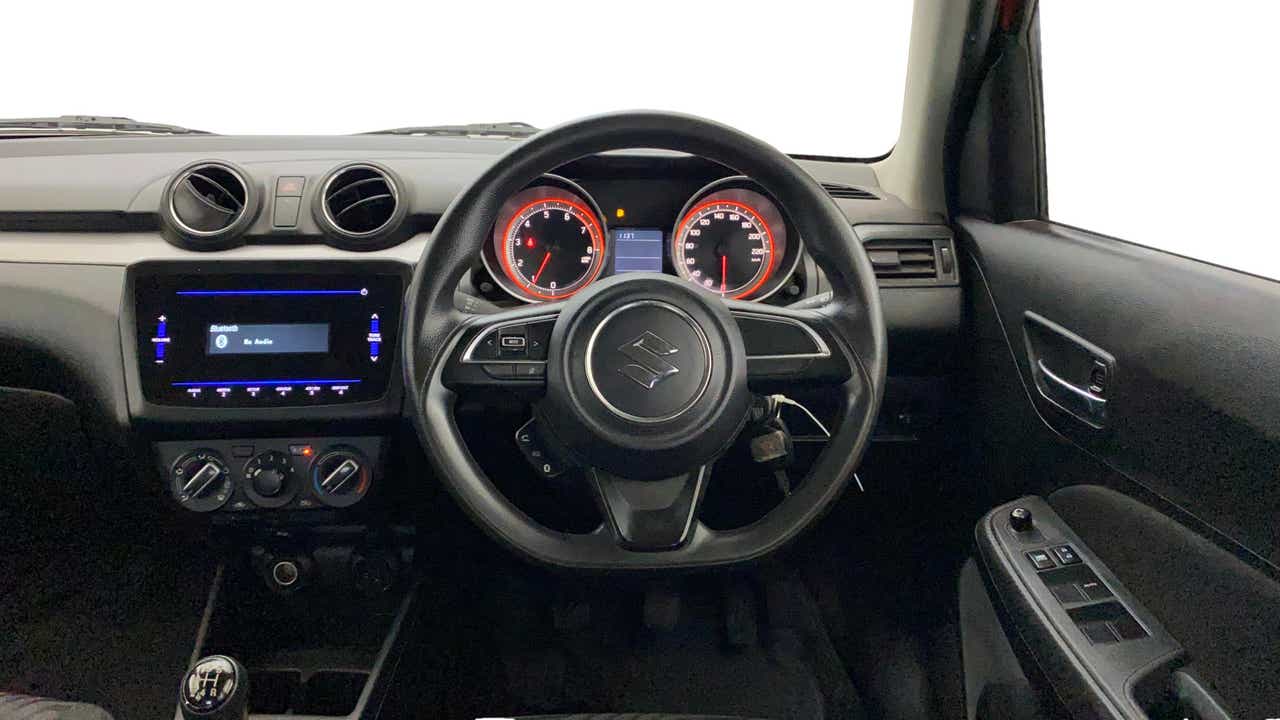 Dashboard and steering wheel view of a Maruti Suzuki Swift 2021 - 2023
