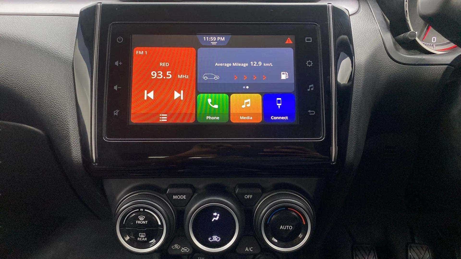 Infotainment system and climate controls of a Maruti Suzuki Swift 2021 - 2023