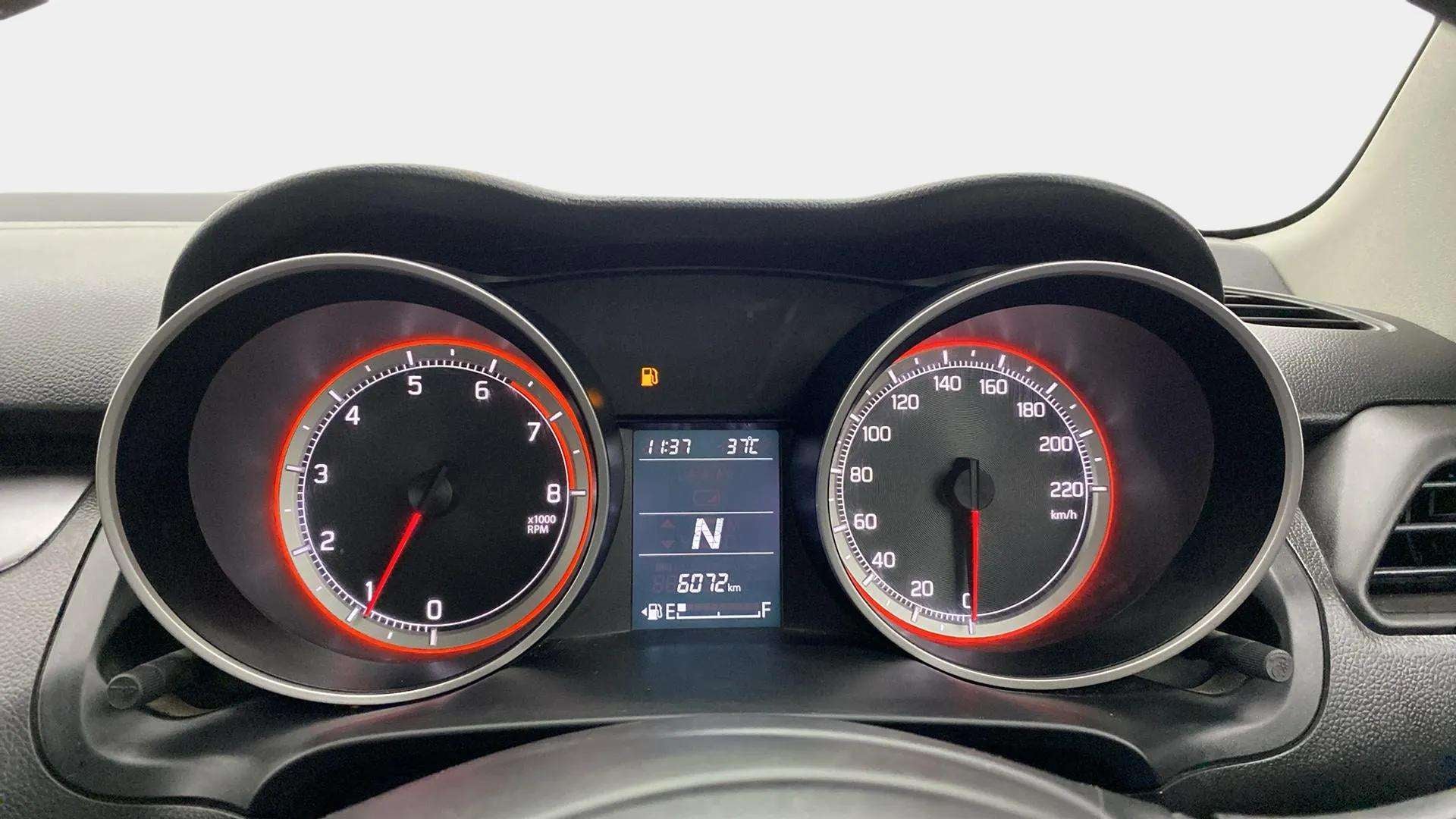 Close-up of the instrument cluster of a Maruti Suzuki Swift