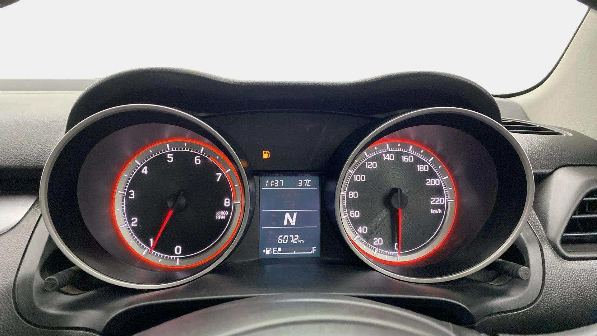 Close-up of the instrument cluster of a Maruti Suzuki Swift