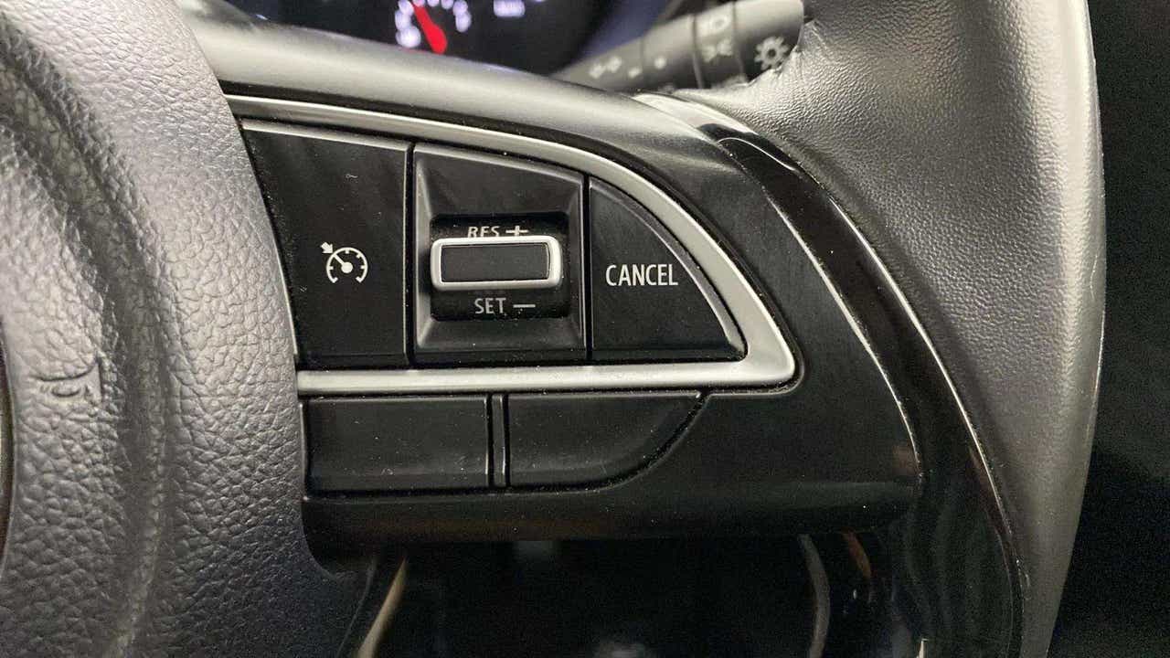 Cruise control steering wheel buttons of a Maruti Suzuki Swift