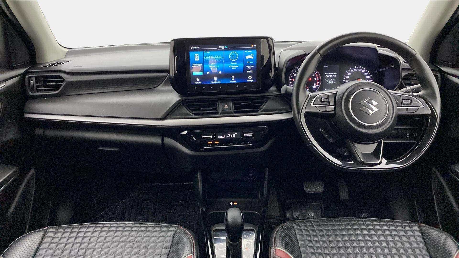 Interior dashboard view of a Maruti Suzuki Swift