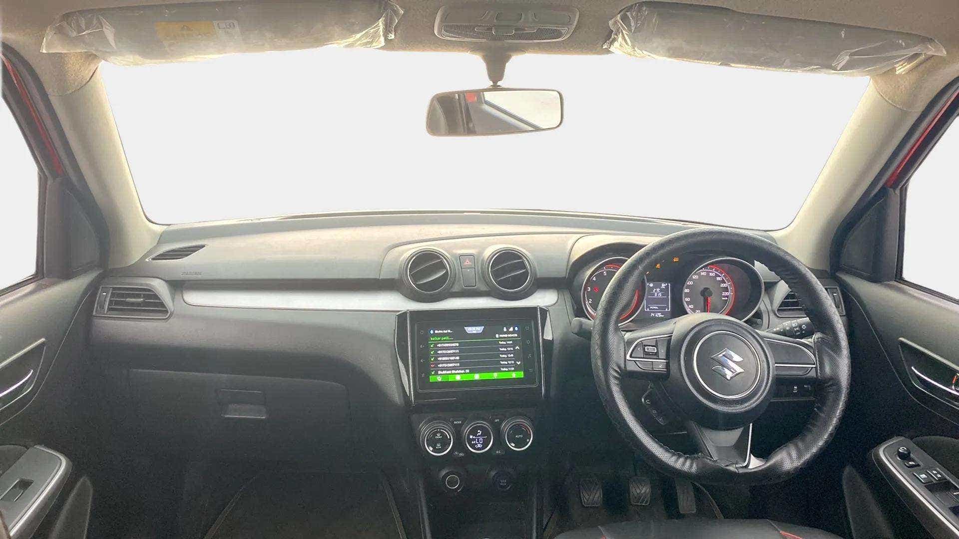 Interior dashboard view of a Maruti Suzuki Swift 2021 - 2023