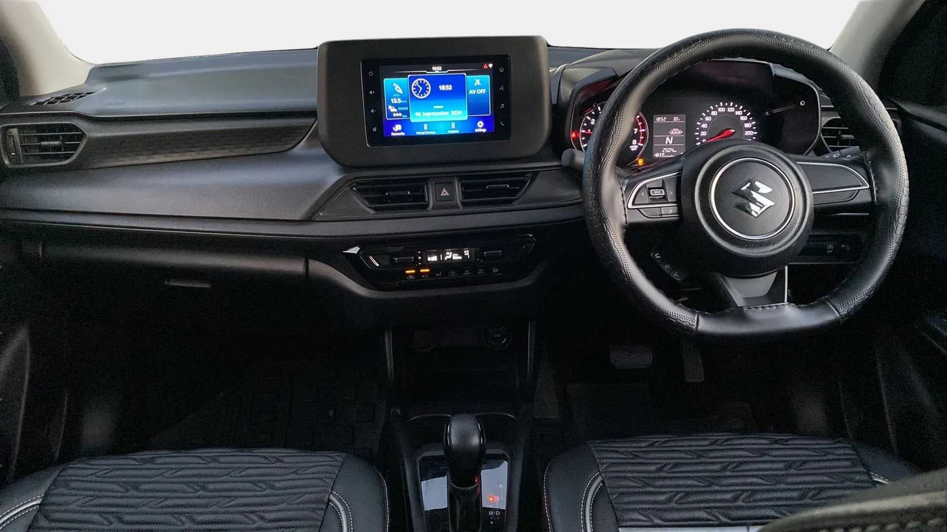 Dashboard and steering wheel view of a Maruti Suzuki Swift