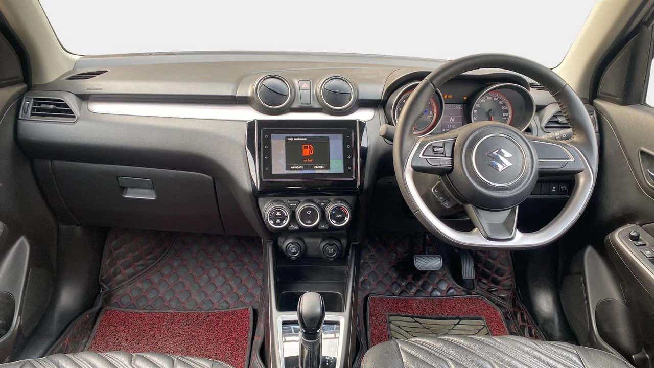 Interior dashboard view of a Maruti Suzuki Swift 2021 - 2023