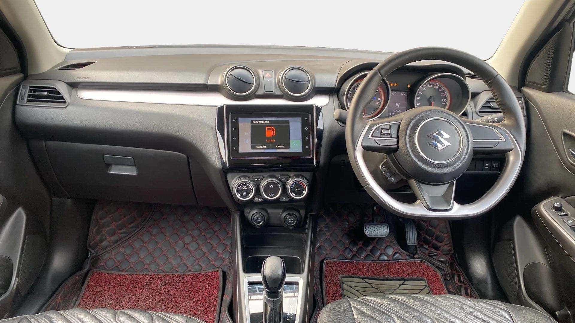 Interior dashboard view of a Maruti Suzuki Swift 2021 - 2023