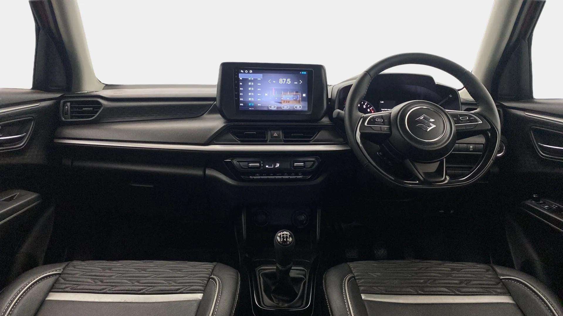 Dashboard and steering wheel of a Maruti Suzuki Swift