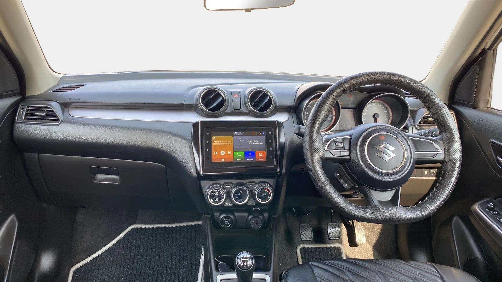 Dashboard and steering wheel of a Maruti Suzuki Swift