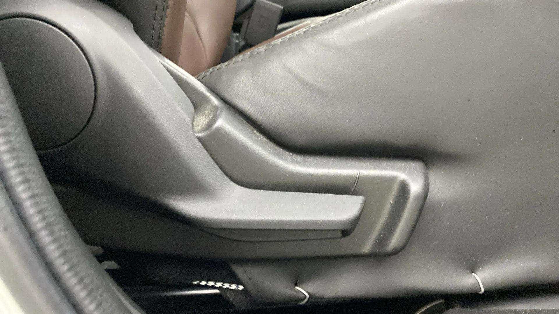 Close-up of seat adjustment lever of a Maruti Suzuki Swift