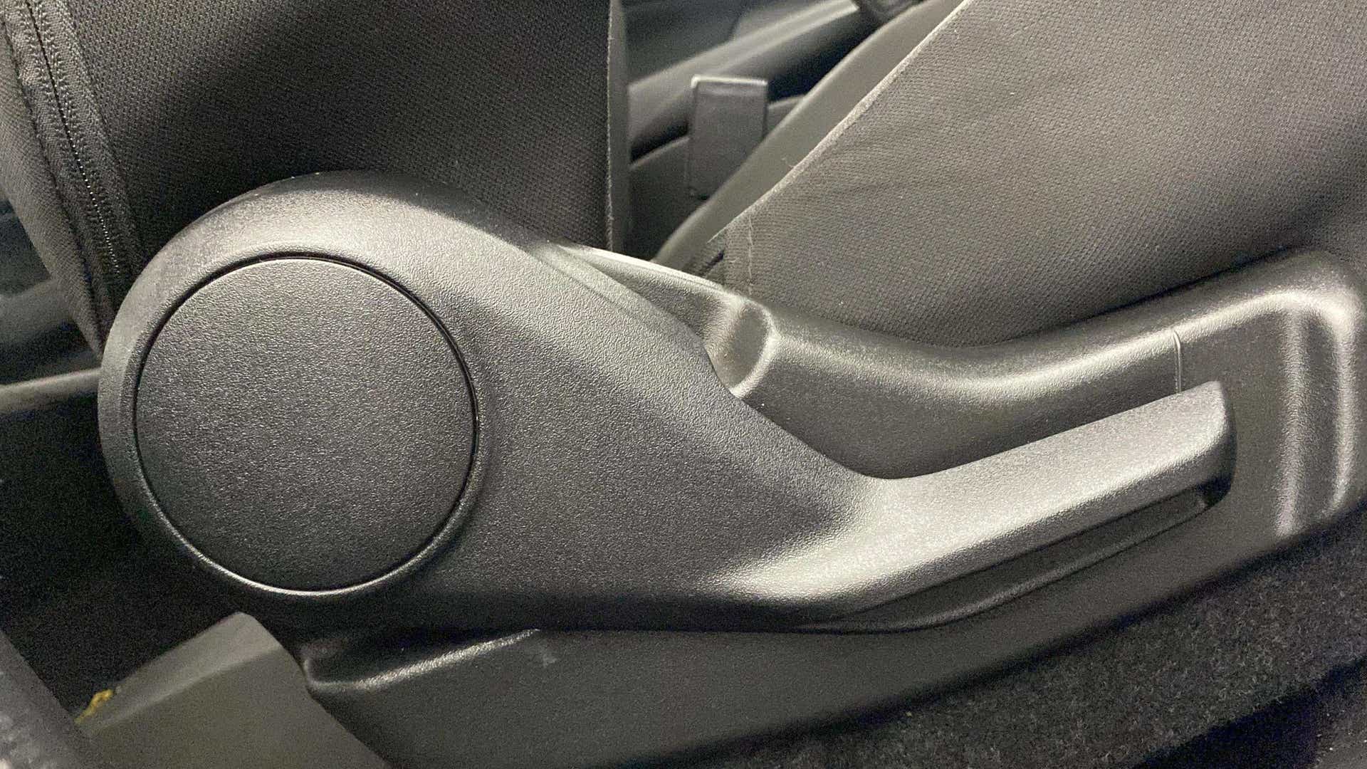 Close-up of a seat adjuster lever of a Maruti Suzuki Swift