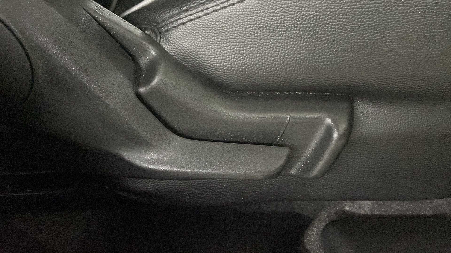 Close-up of a seat adjustment lever of a Maruti Suzuki Swift 2021 - 2023