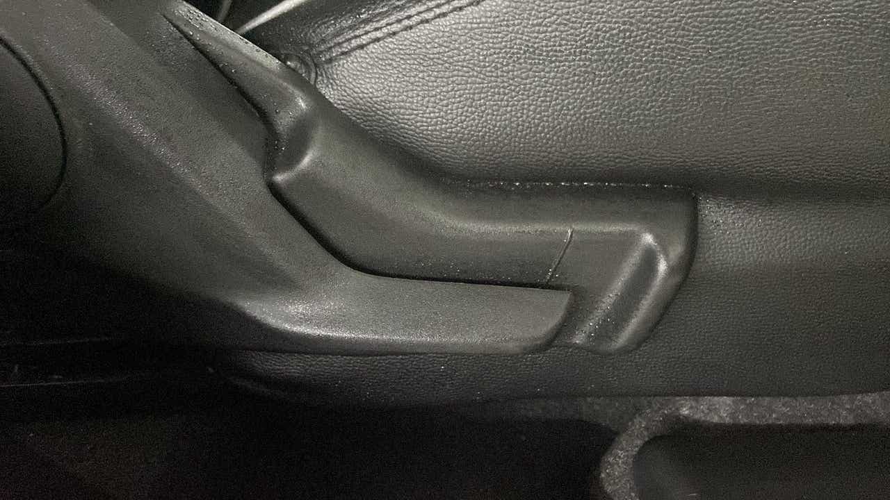 Close-up of a seat adjustment lever of a Maruti Suzuki Swift 2021 - 2023