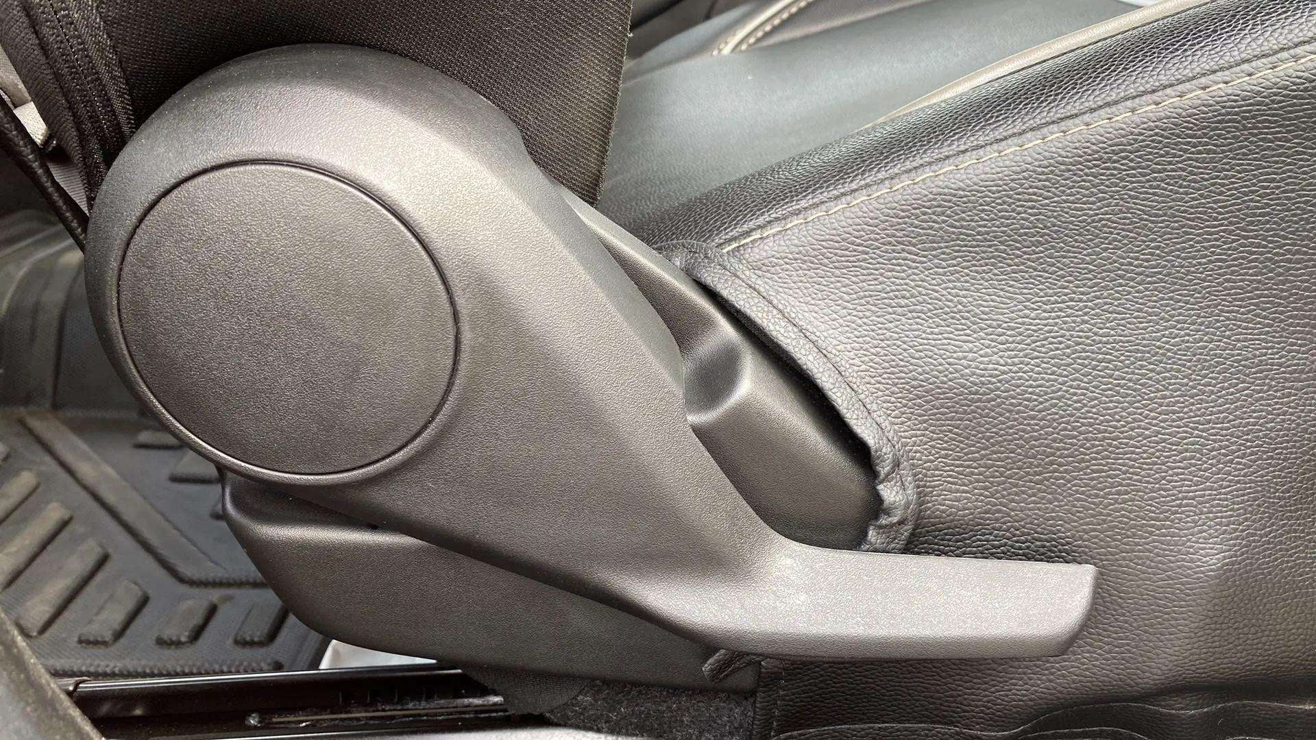 Close-up of a seat adjustment lever of a Maruti Suzuki Swift