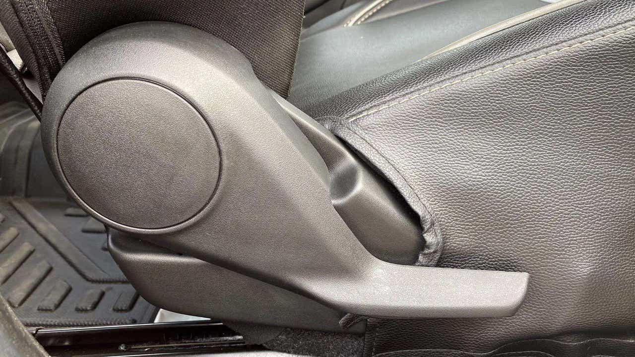 Close-up of a seat adjustment lever of a Maruti Suzuki Swift