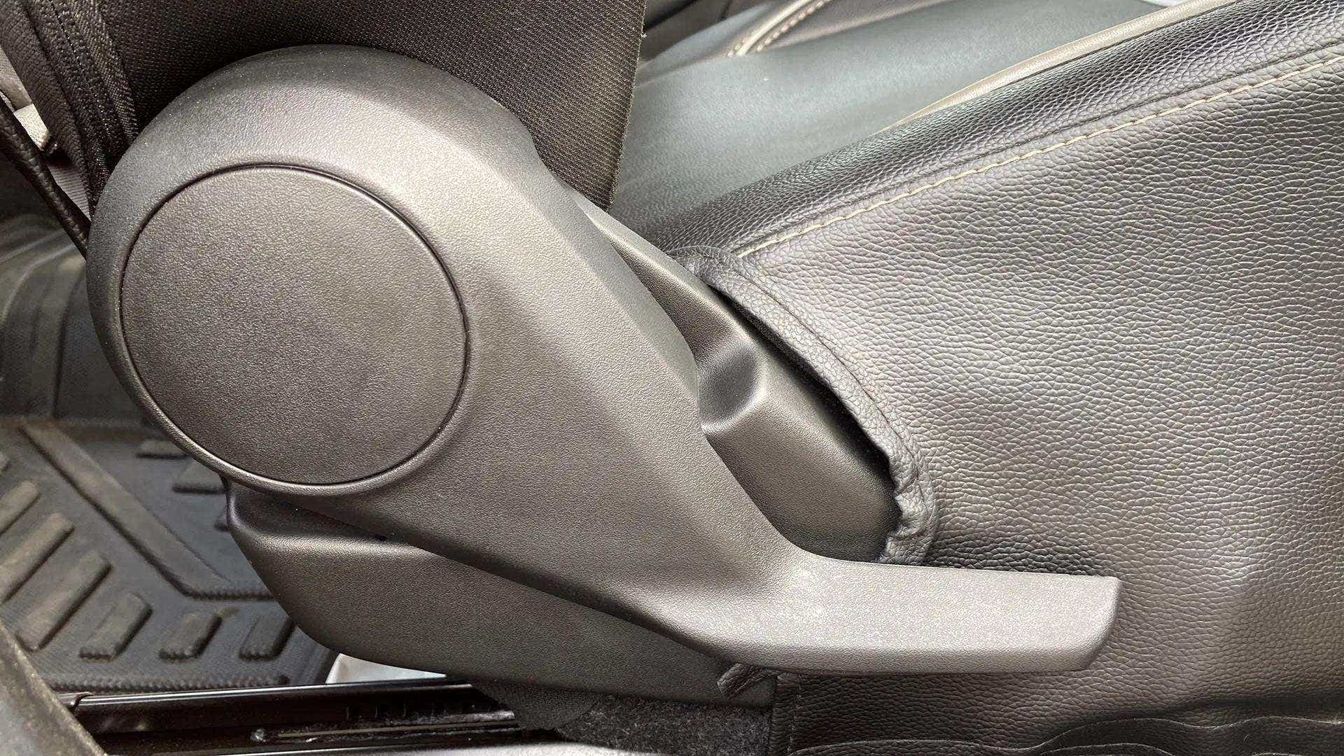 Close-up of a seat adjustment lever of a Maruti Suzuki Swift