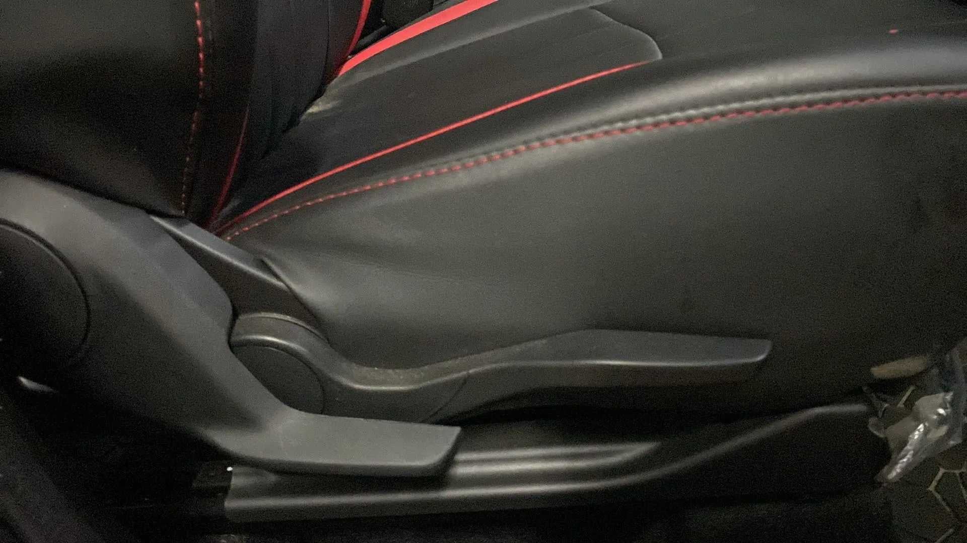 Close-up of the front seat adjustment lever of a Maruti Suzuki Swift 2021 - 2023