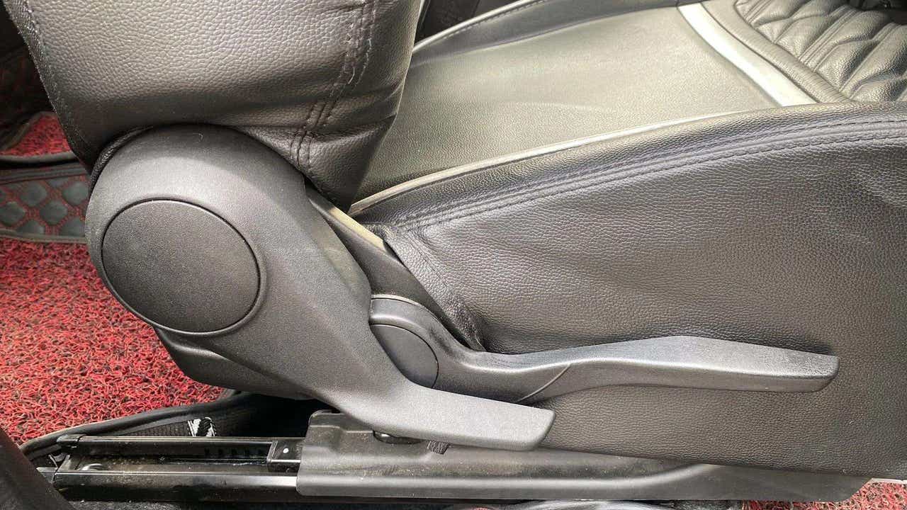 Seat adjustment lever area of a Maruti Suzuki Swift 2021 - 2023