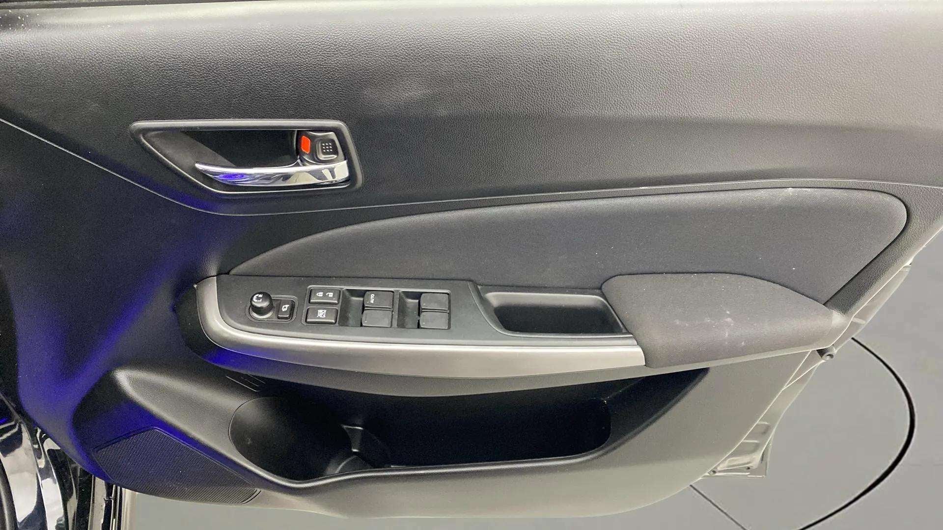 Driver side door panel of a Maruti Suzuki Swift