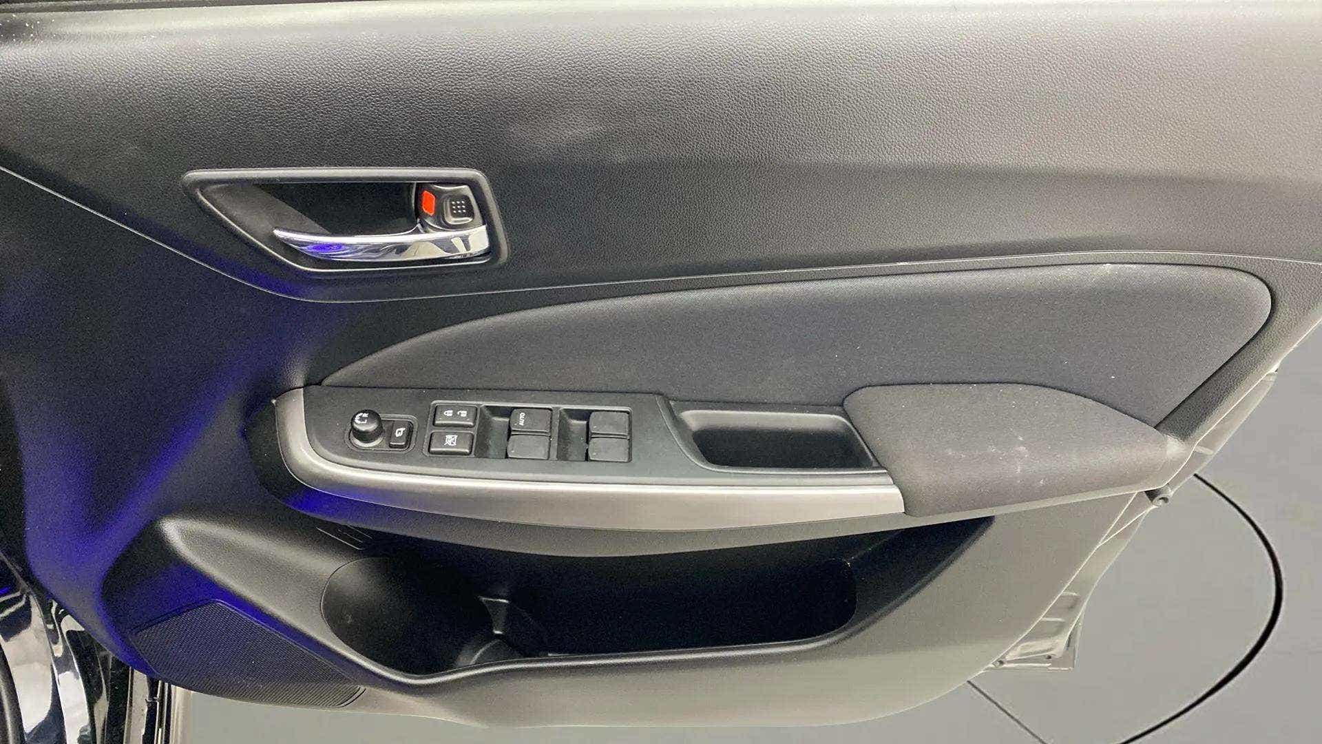 Driver side door panel of a Maruti Suzuki Swift