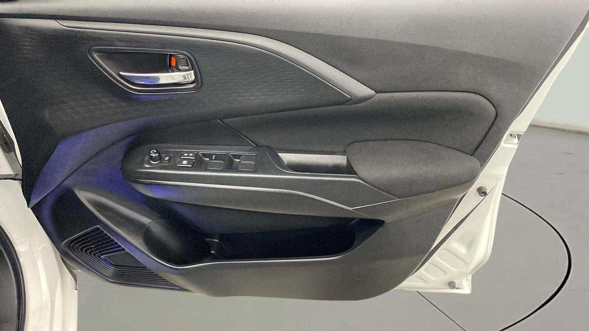 Interior door panel of a Maruti Suzuki Swift
