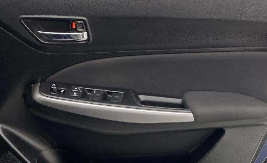 Interior door panel of a Maruti Suzuki Swift
