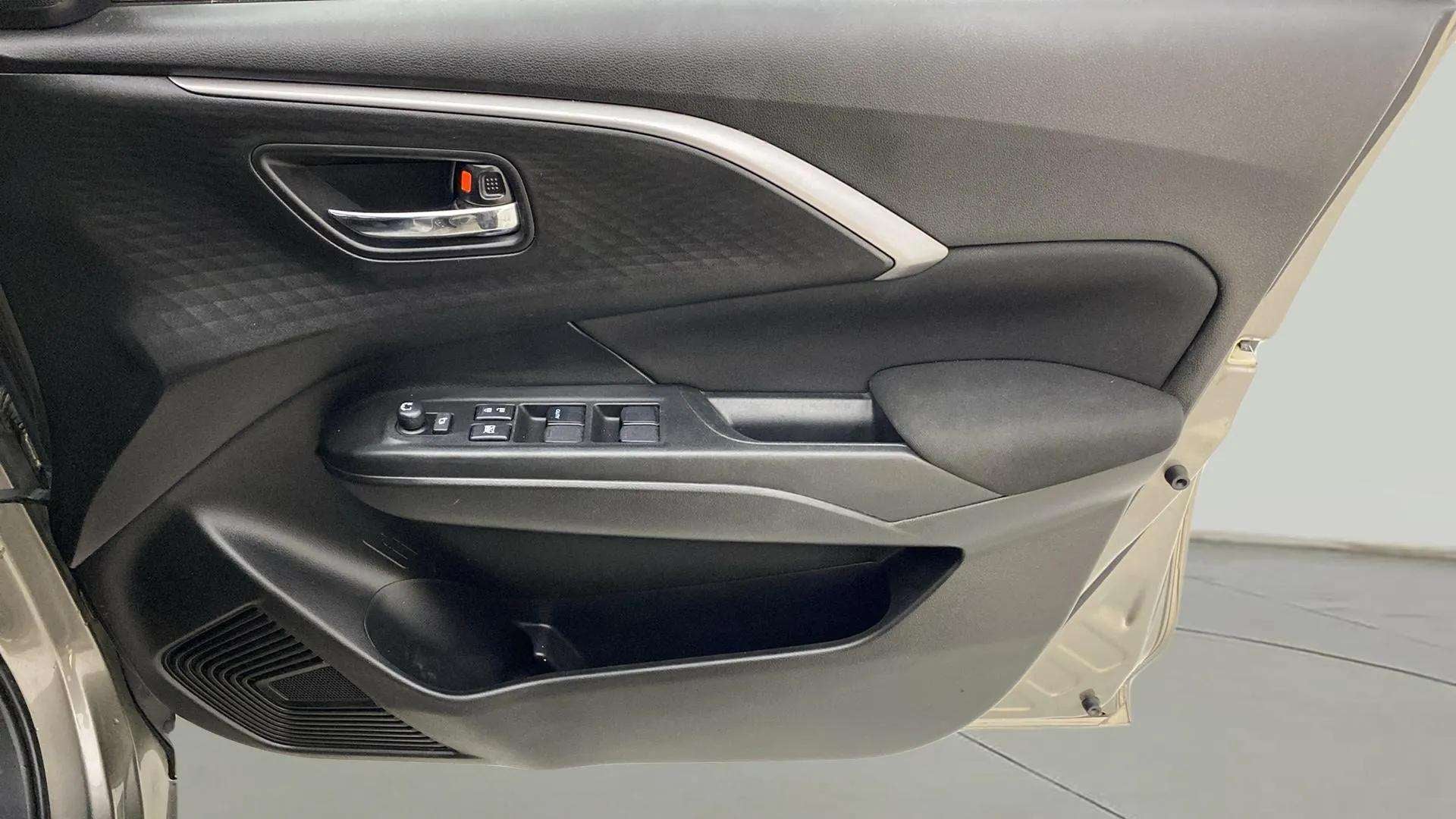 Interior door panel of a Maruti Suzuki Swift