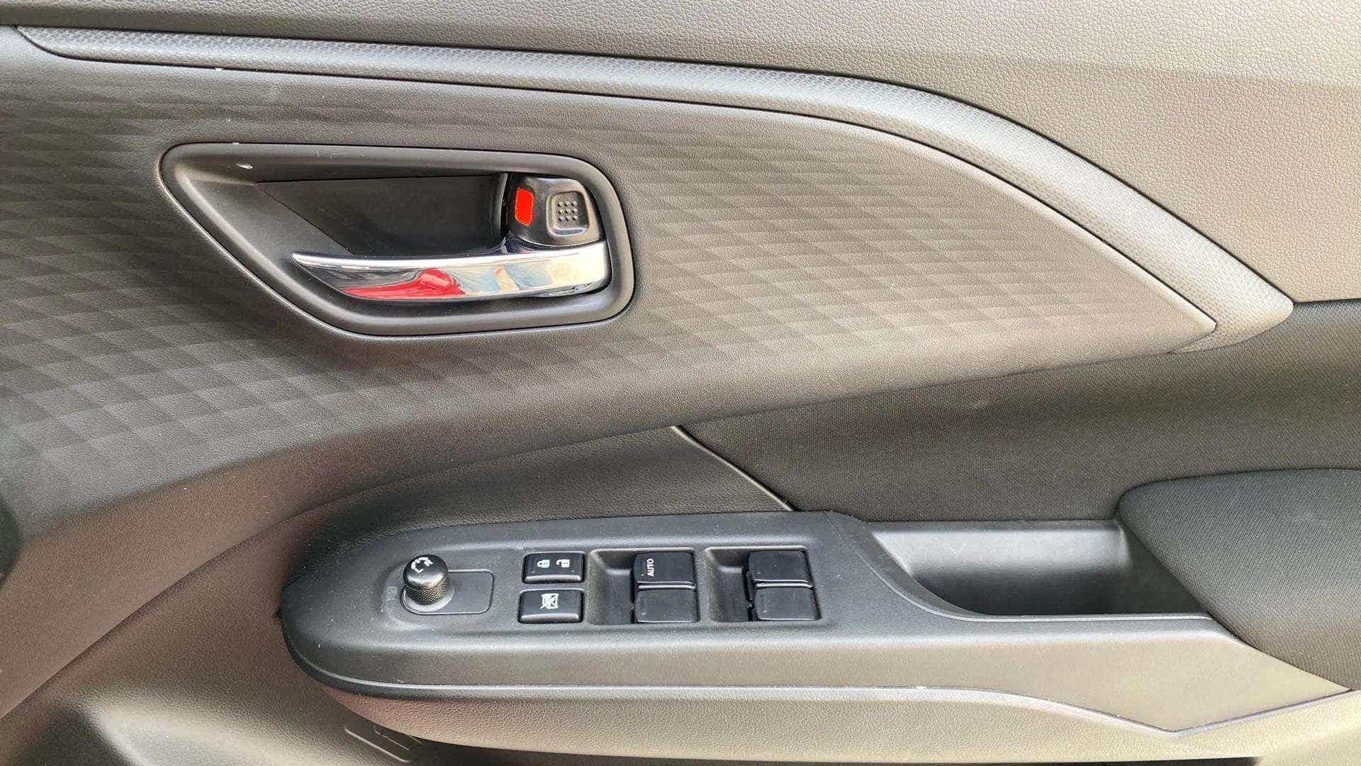 Driver side door panel of a Maruti Suzuki Swift