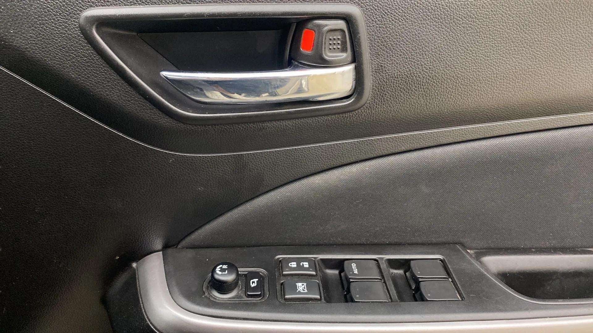 Driver side door controls of a Maruti Suzuki Swift 2021 - 2023
