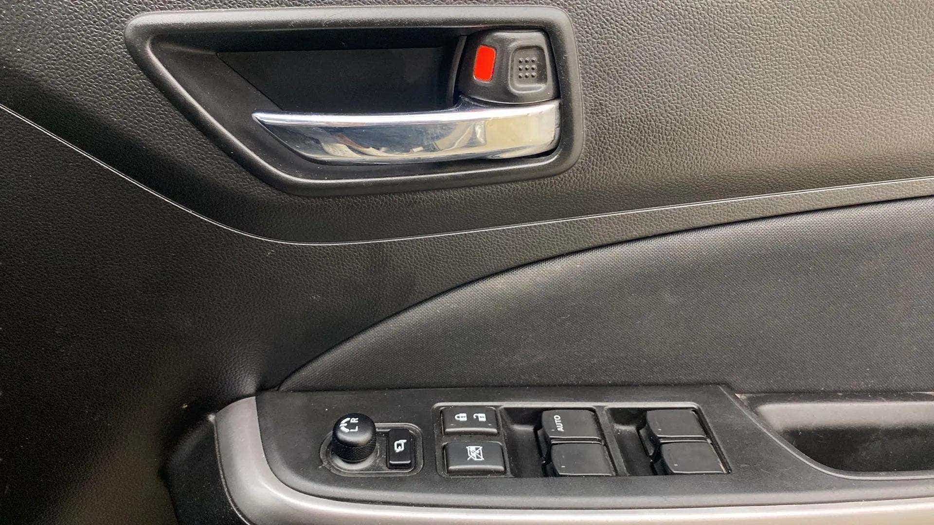 Driver side door controls of a Maruti Suzuki Swift 2021 - 2023