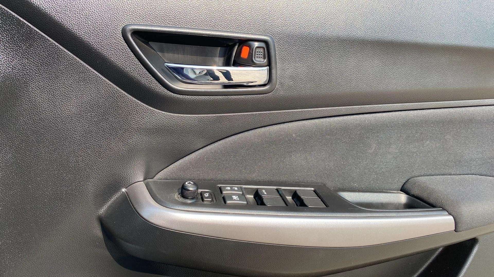 Driver side door controls of a Maruti Suzuki Swift