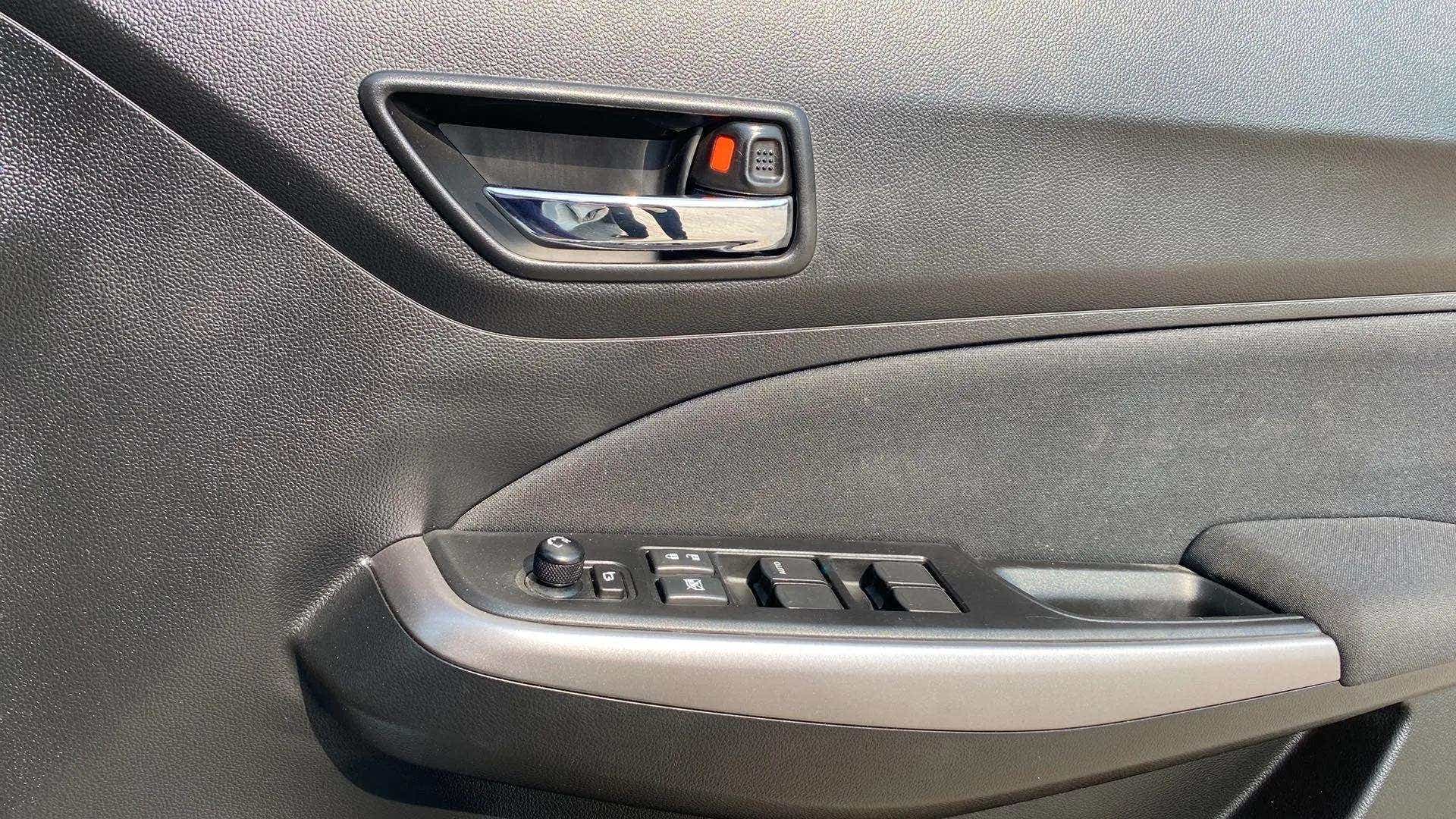 Driver side door controls of a Maruti Suzuki Swift