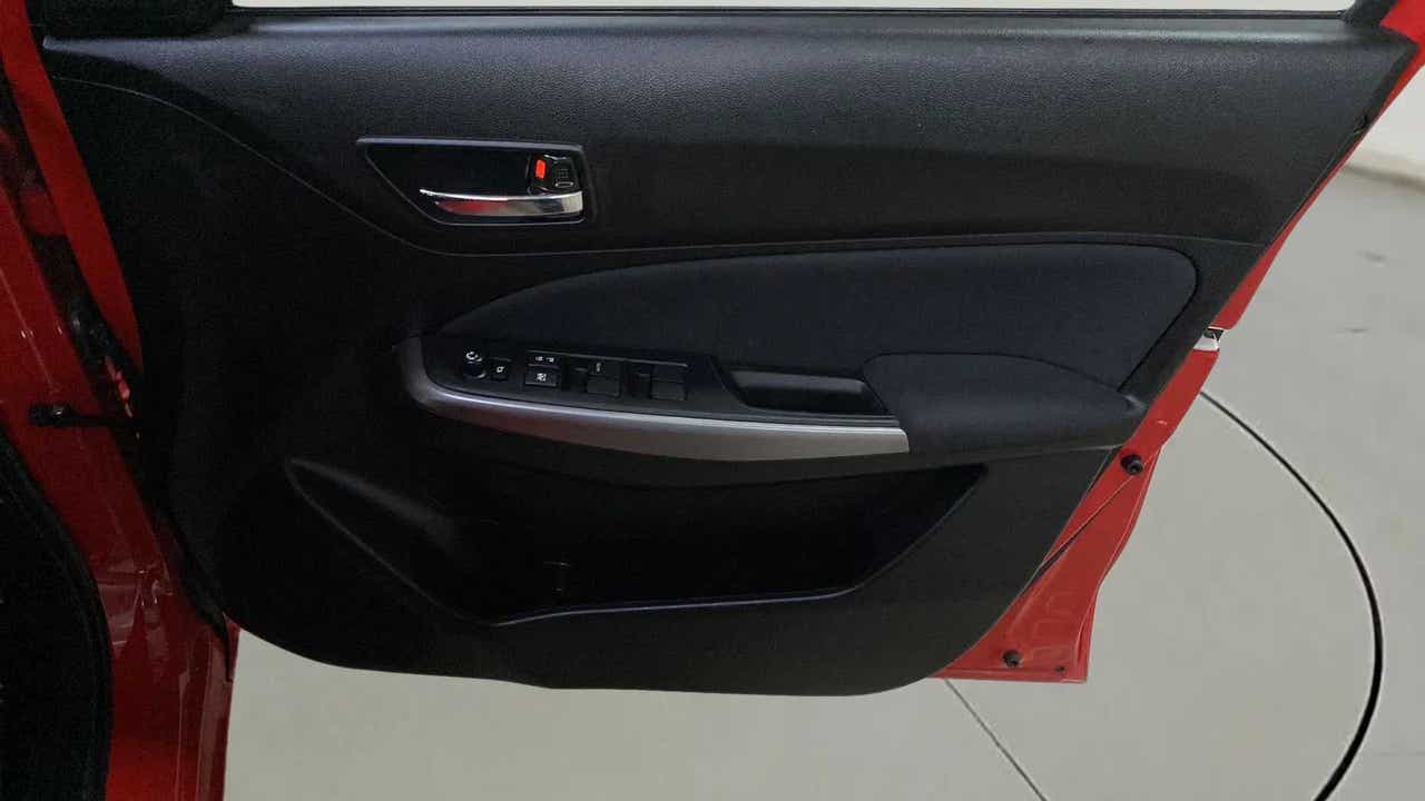 Interior driver side door panel of a Maruti Suzuki Swift 2021 - 2023