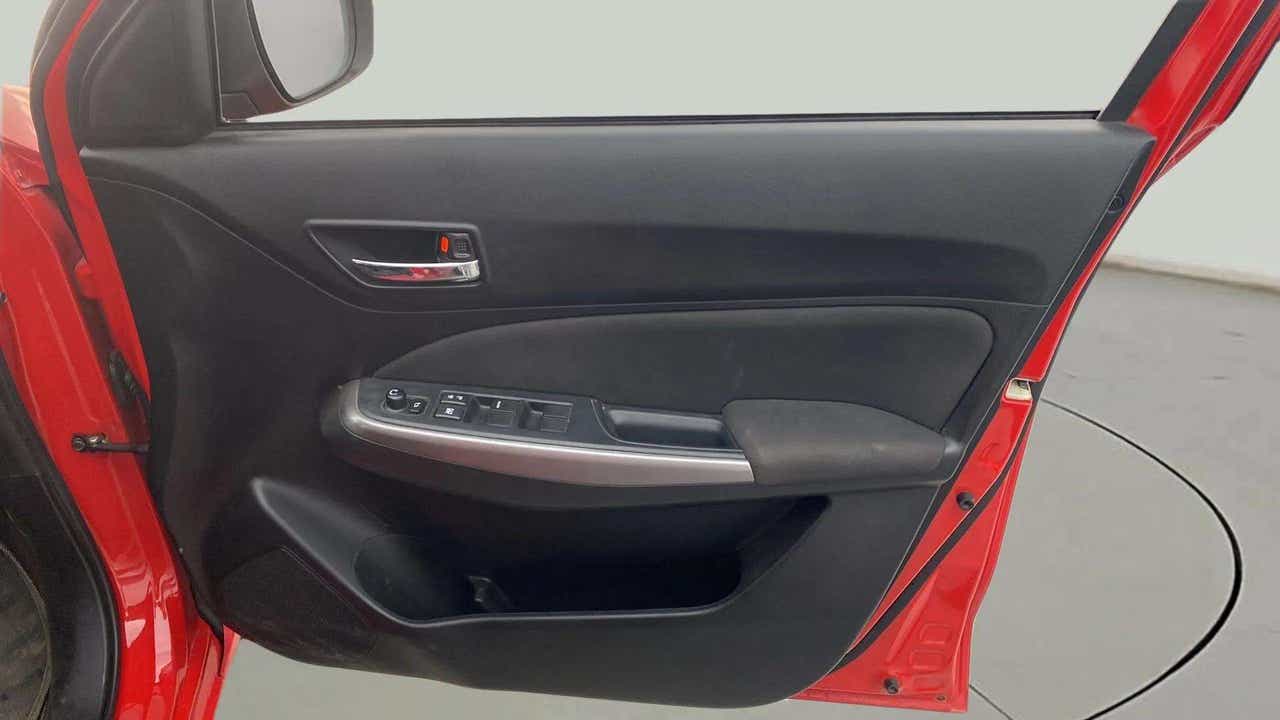 Driver side door panel view of a Maruti Suzuki Swift 2021 - 2023