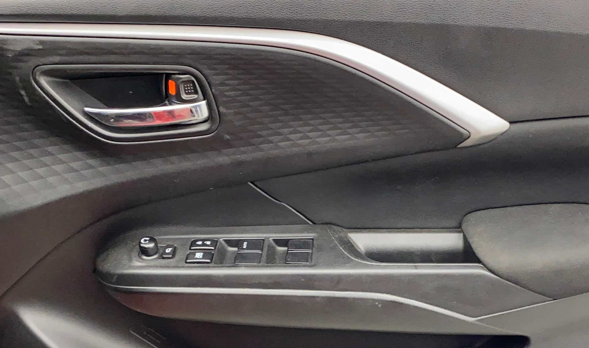 Interior door panel of a Maruti Suzuki Swift