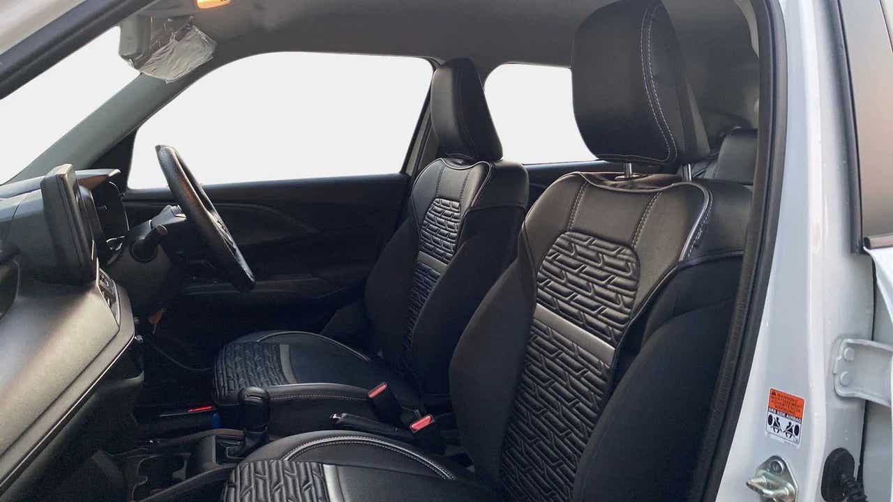 Front seats and dashboard of a Maruti Suzuki Swift