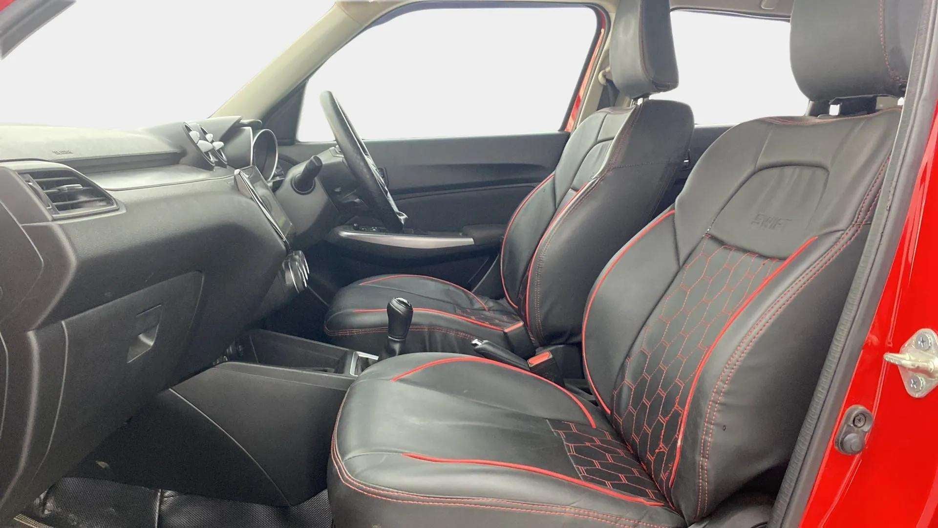 Front seat and dashboard view of a Maruti Suzuki Swift 2021 - 2023