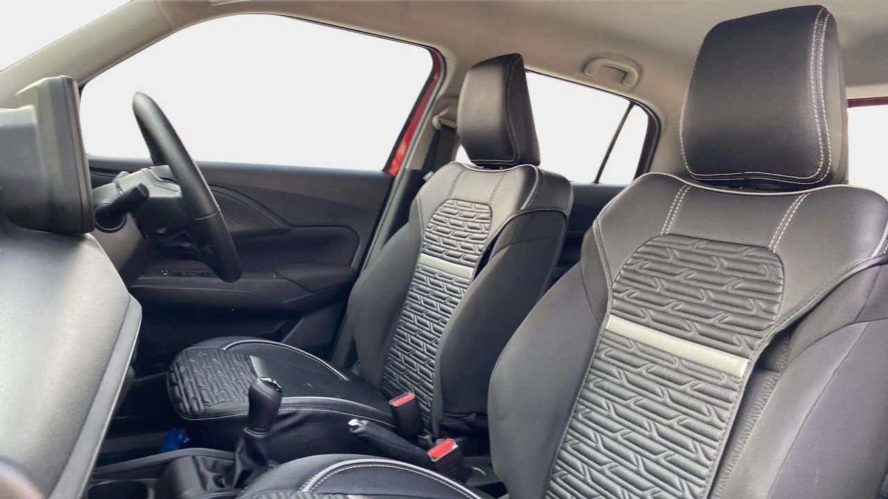 Interior front seats and dashboard of a Maruti Suzuki Swift