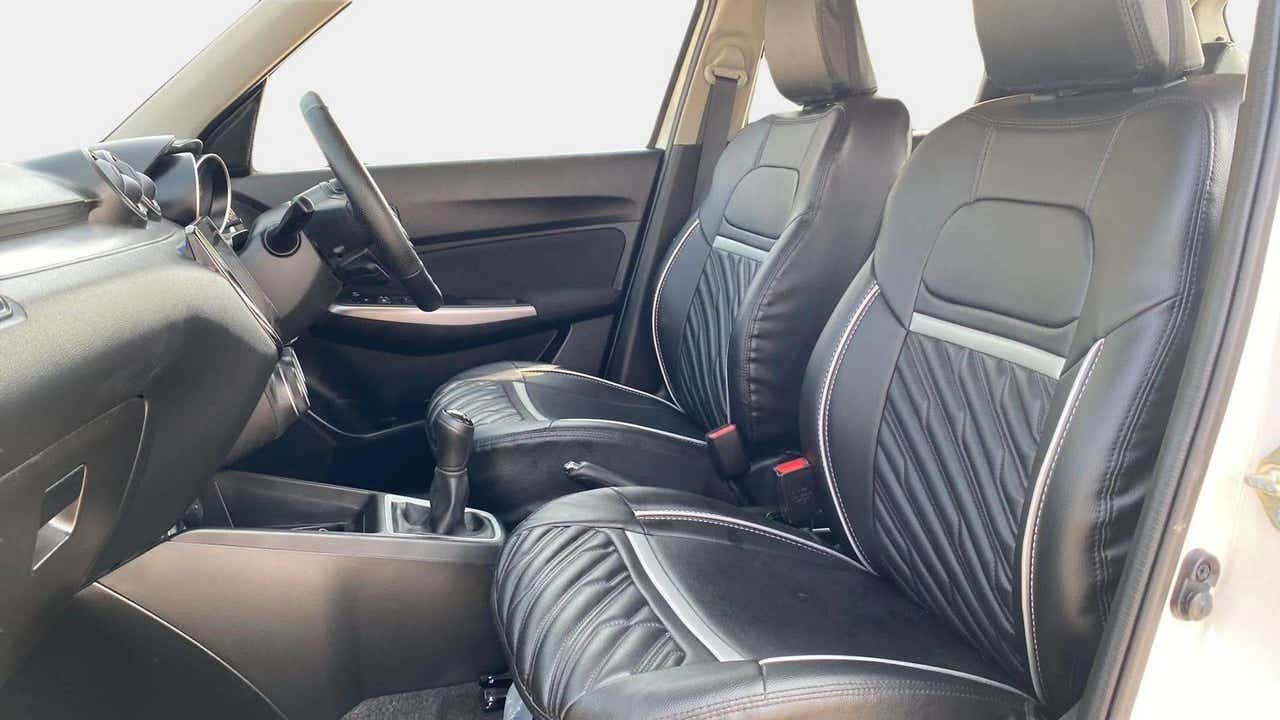 Front seats and dashboard of a Maruti Suzuki Swift